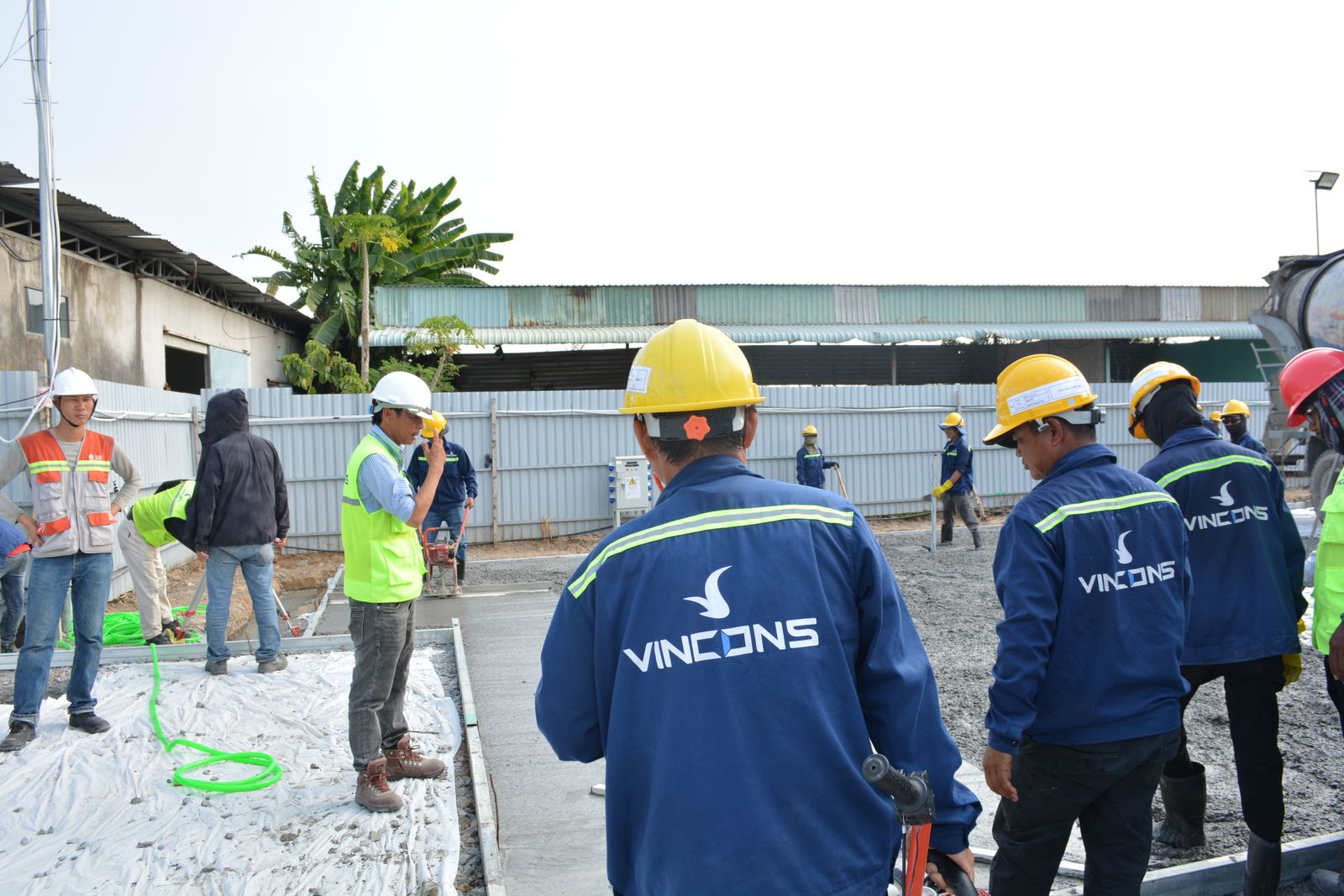 Crew in hard hats assessing a site